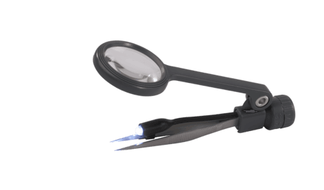 Forstørrelsesglass med lys og pinsett